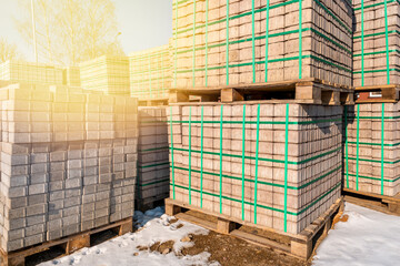 Concrete pavement tiles stacked on the wooden pallets