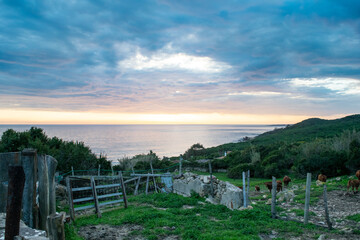 Fototapeta na wymiar Dramatic sunset cloudy sky over Andalusian Atlantic coast of Tarifa in Punta Paloma