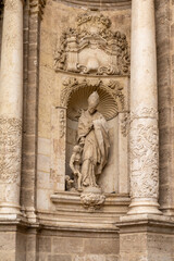architectural detail of the stone sculptures at the entrance of the cathedral of Valencia