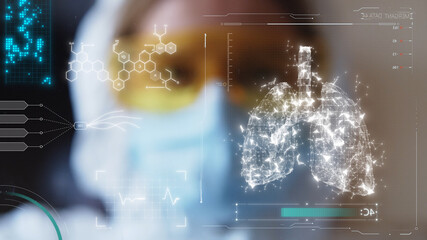 Young female doctor in eyeglasses and protective mask looking at 3d lungs model. Futuristic technology. Medicine concept. Human health care. Lung infecting process. Medical innovation. Breathing.
