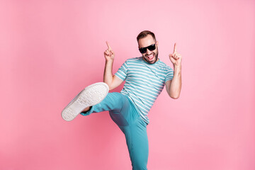 Portrait of nice naughty cheerful funky guy dancing having fun wear sunglasses showing sole...