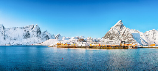 Fabulous winter view of Sakrisoy village and snowy mountaines on background.