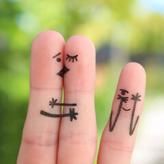 Fingers art of happy family. Concept of couple kisses,  child spies on them.