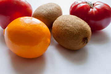 Wooden plate of fruits apple, pear, melon, mango, mandarin, banana, strawberry on a white background, isolated.