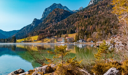 Beautiful alpine autumn or indian summer view with reflections at the famous Hintersee, Ramsau, Berchtesgaden, Bavaria, Germany