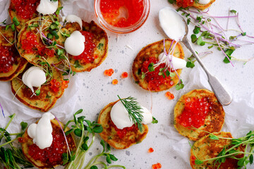 Potato pancakes with caviar.top view.style rustic