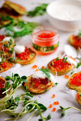 Potato pancakes with caviar.top view.style rustic