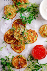 Potato pancakes with caviar.top view.style rustic