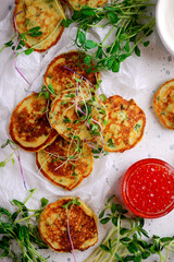 Potato pancakes with caviar.top view.style rustic