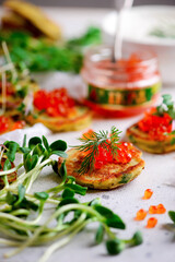 Potato pancakes with caviar.top view.style rustic