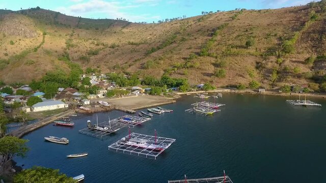 aerial view of bay Bima, Indonesia West Nusa Tenggara, fisherman boat and little rural village in remote area.