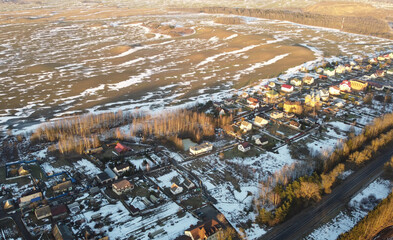 Top view of a spring agricultural field at sunset