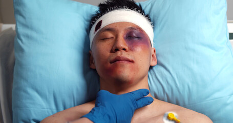 Cloe up of medical staff moving seriously injured man on a stretchers