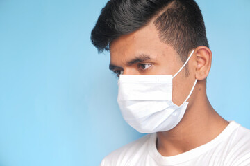Close up of man with protective face mask looking at camera 