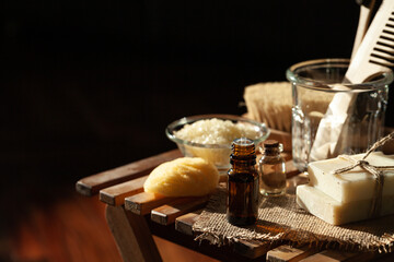 Zero waste and sustainable lifestyle concept. Eco-friendly bathroom accessories. Handmade soap, organic essential oil, sea salt, wooden background. Home body, face care. Close-up copy space for text