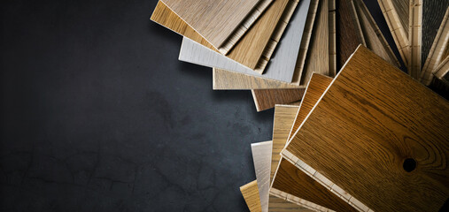 wooden texture flooring material samples on black stone background. banner copy space