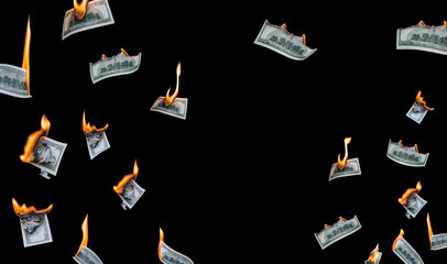 Several 100 dollar bills, falling down, burn on a black background. The concept of bankruptcy,...