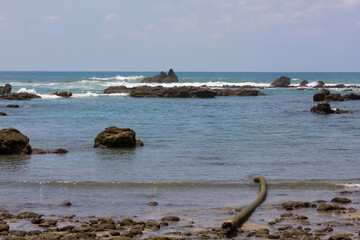 Fototapeta na wymiar Landscape of a stony coast located in the Corcovado national park, Osa, Costa Rica.