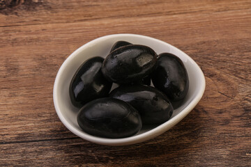 Pickled black olives in the bowl