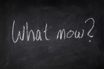 what now handwritten question on chalkboard - uncertainty, angst