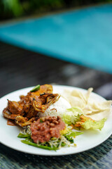 Ayam Taliwang food, special food is young smoked chicken, spiced and then burned, and chili or plecing water spinach. Indonesia food
