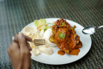 Ayam Taliwang food, special food is young smoked chicken, spiced and then burned, and chili or plecing water spinach. Indonesia food
