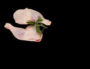 Fresh raw chicken legs isolated black background 