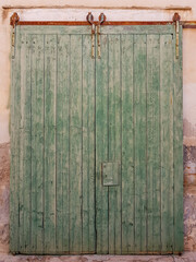 old textured and weathered green wooden door