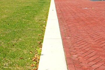 Walk the white line - Green grass white line red stones