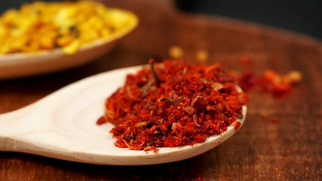 spice paprika close-up in a wooden spoon close-up. selective focus