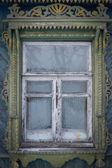 Window of an old, rustic, wooden house with.