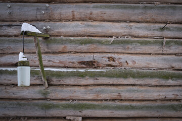 Old street lamp on a wooden wall. 