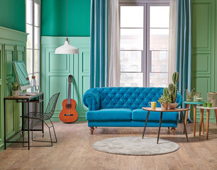 Green living room, classic wall background with blue sofa and lamp with vase of plant.