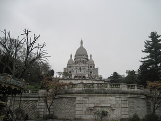 Panorama of the famous cathedral Sacre Coeur on a cloudy day. Scenic view of famous landmark in the morning.