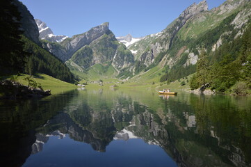 Naklejka na ściany i meble Landscape photo of mountain reflected in lake
