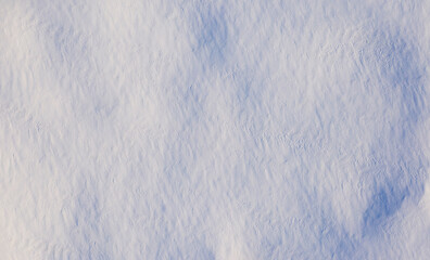 Fototapeta premium White fluffy snow, texture or background, top view.