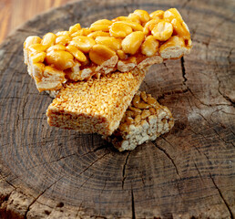 Kozinaki of sesame on the wooden background