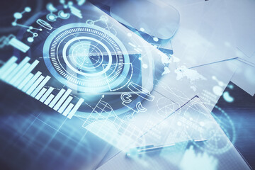 Double exposure of business theme hologram over desktop with phone. Top view. Mobile international trade connection concept.