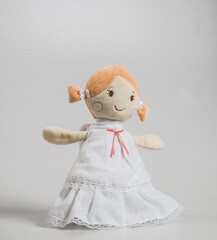 Christmas doll angel made of fabric and wool, soft toy isolated on white background. © baxys