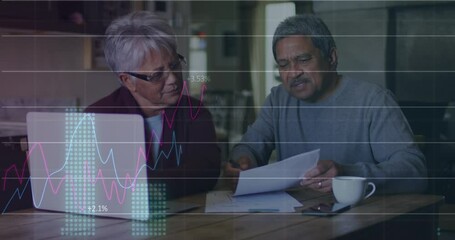 Financial data processing against african american senior couple calculating finances at home - Powered by Adobe