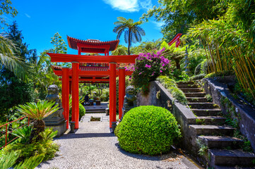 Monte Palace - Tropical Garden with Waterfalls, Lakes and traditional buildings above the city of...