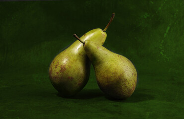Group of pears over green background