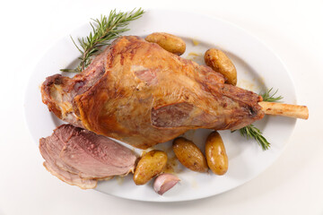 baked lamb leg and potatoes
