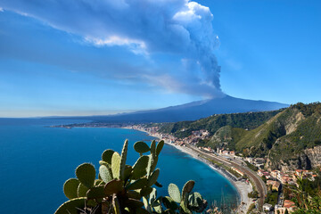 volcano in Sicily taken from the road that climbs to get to Taormina on a beautiful sunny day in spring 2021, you can see the station and Giardini Naxos with the whole  - obrazy, fototapety, plakaty