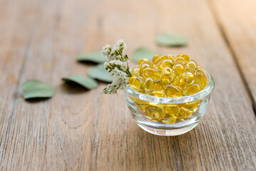 Healthy Vitamins, Omega 3,top view, has a wood background, copy Space.