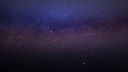Multicolored stars in the night sky. The Milky Way.
