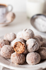 Homemade cottage cheese donuts balls with powdered sugar in a bowl on a light background. Beautiful breakfast. 