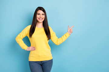 Portrait of nice optimistic brunette long hairdo lady point empty space wear yellow shirt isolated on bright blue color background