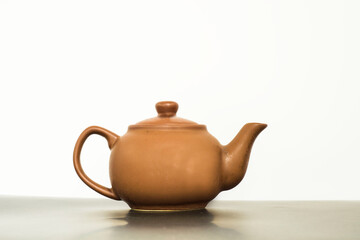 old teapot on white background isolated