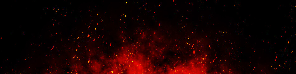 Fire embers particles over black background. Fire sparks background. Abstract dark glitter fire particles lights.